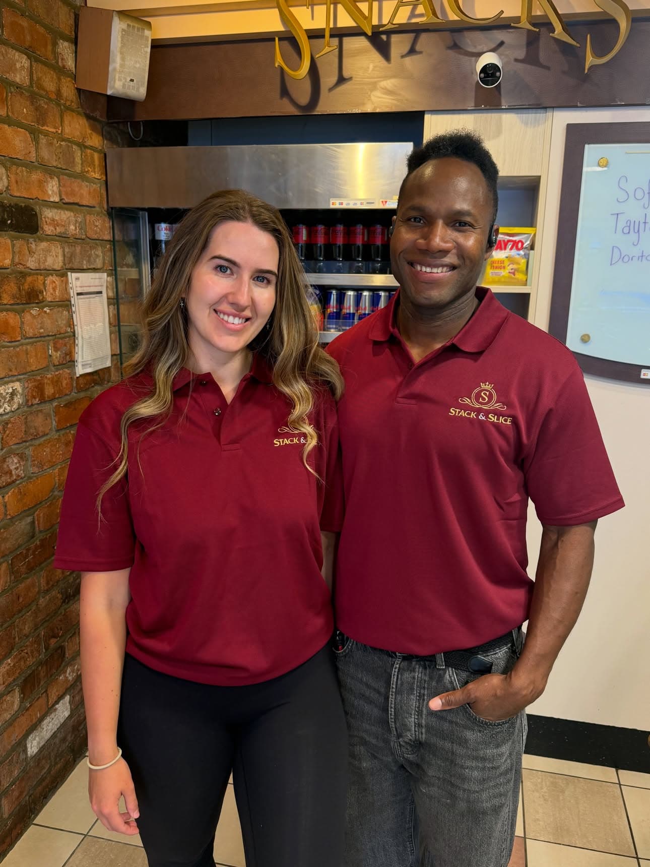 The Stack & Slice team in shop, wearing burgundy uniforms